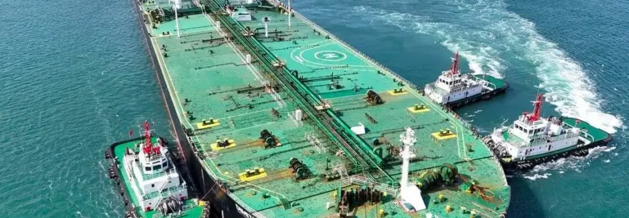 Service boats alongside a tanker during marine service operations